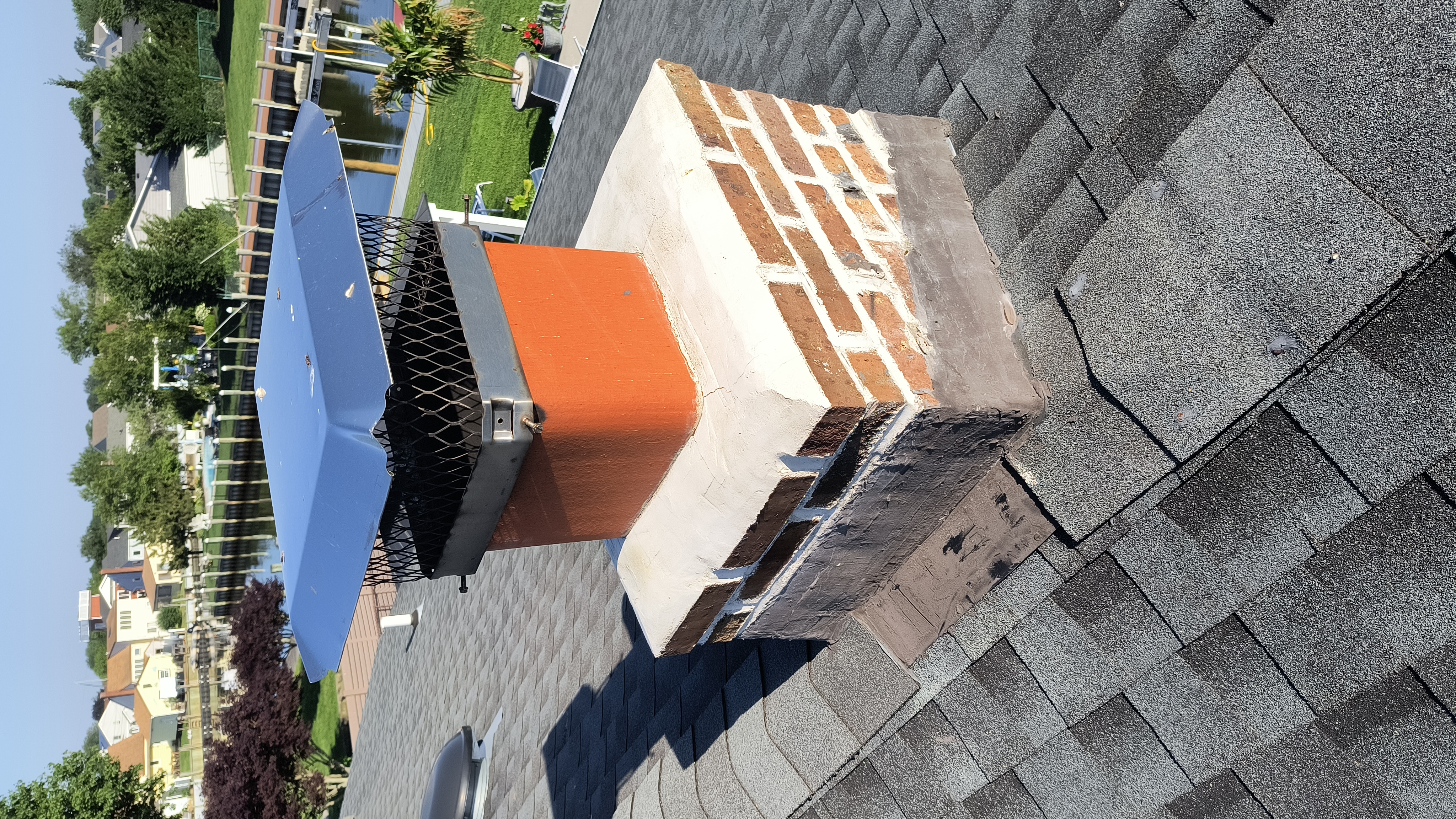 Full chimney masonry rebuild and restoration in Merrick, NY