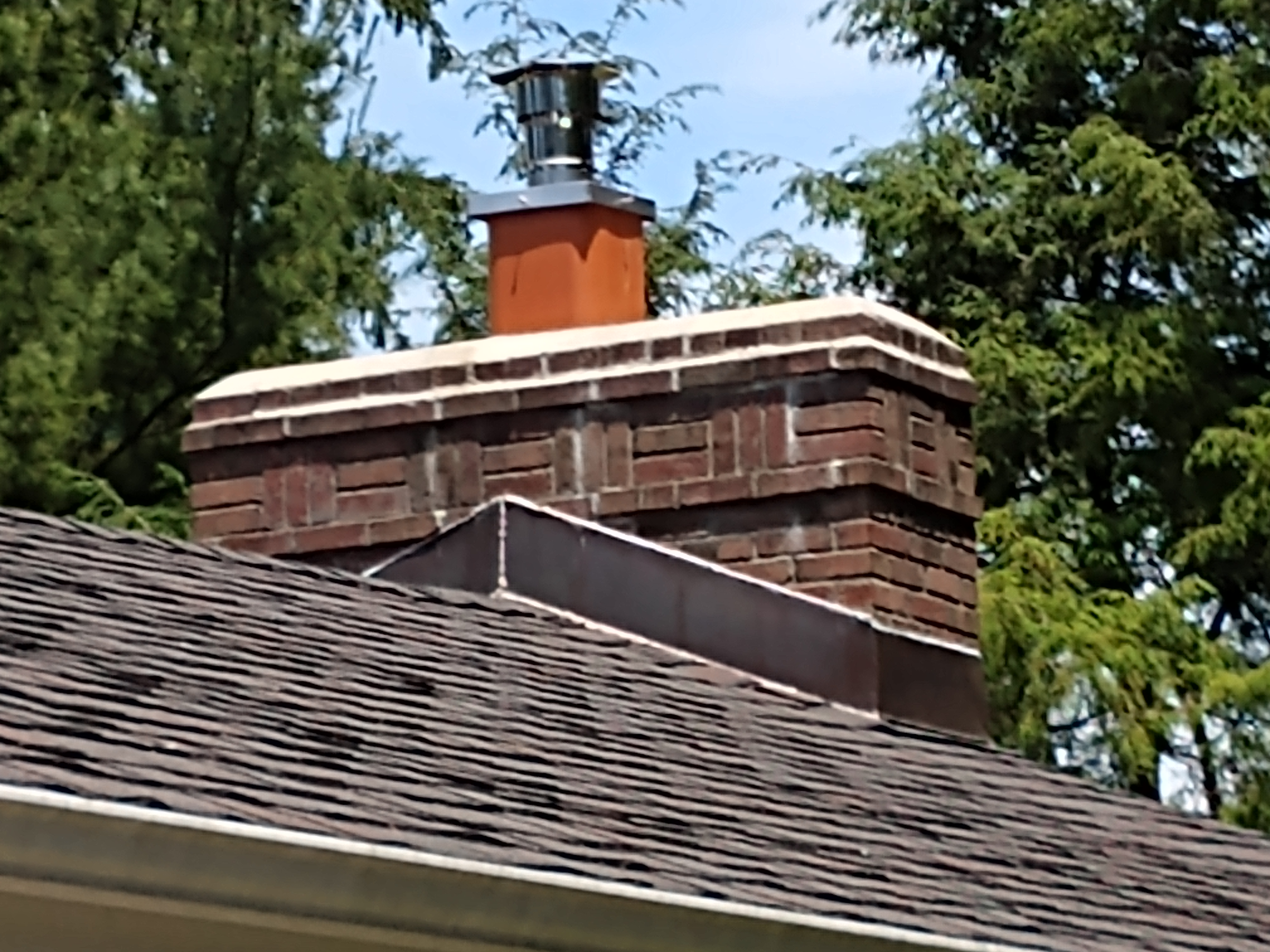 Stainless steel chimney cap with animal guard in Merrick, New York